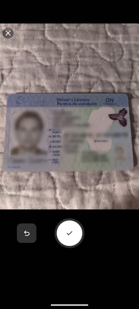 A real driver's licence photo being taken in the app's camera capture screen