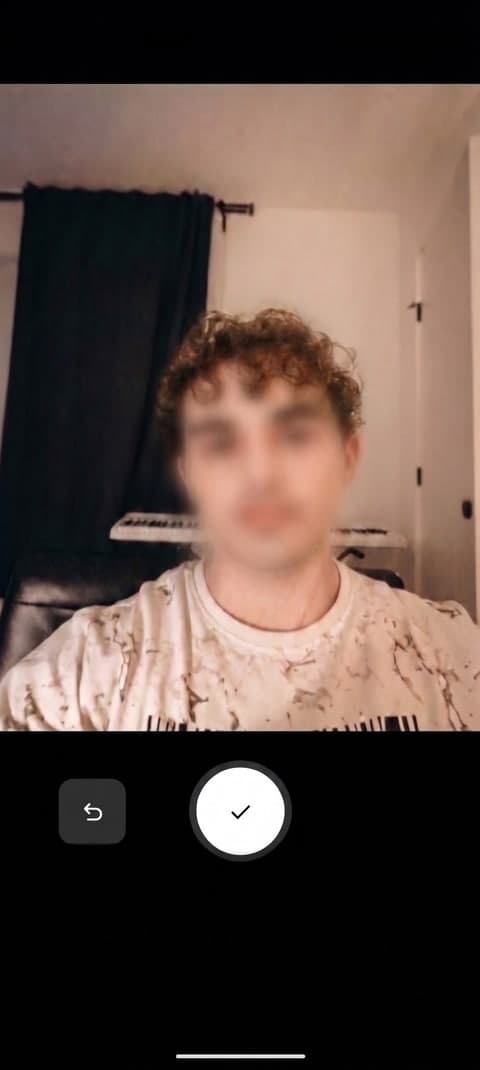 A real selfie being taken in the app's camera capture screen